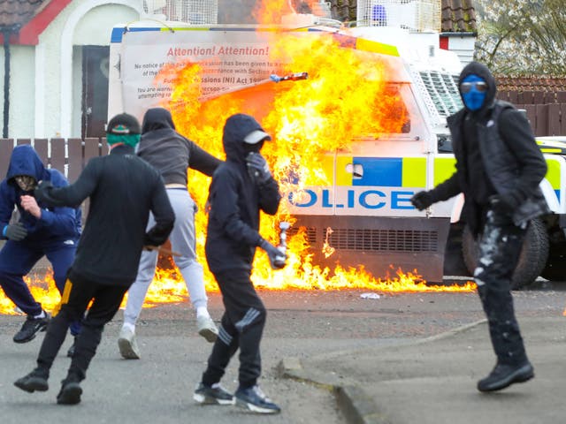 <p>Masked youths attack a Police landrover with petrol bombs  after Republicans took part in a march to commemorate the 1916 Easter Rising</p>