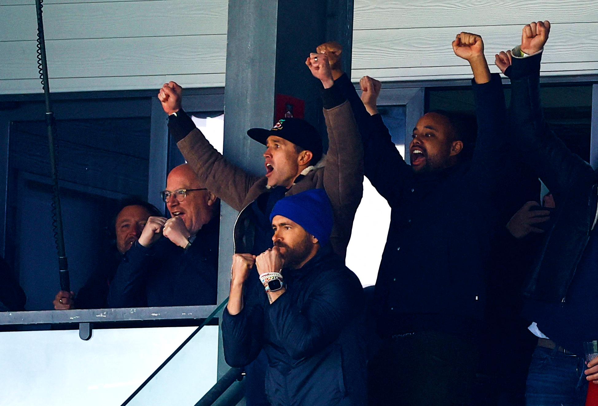 Ryan Reynolds, front, and co-owner Rob McElhenney celebrate victory