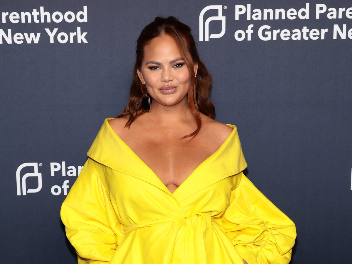 Chrissy Teigen hits back after critics claim she’s not using baby carrier correctly: ‘She is safe’