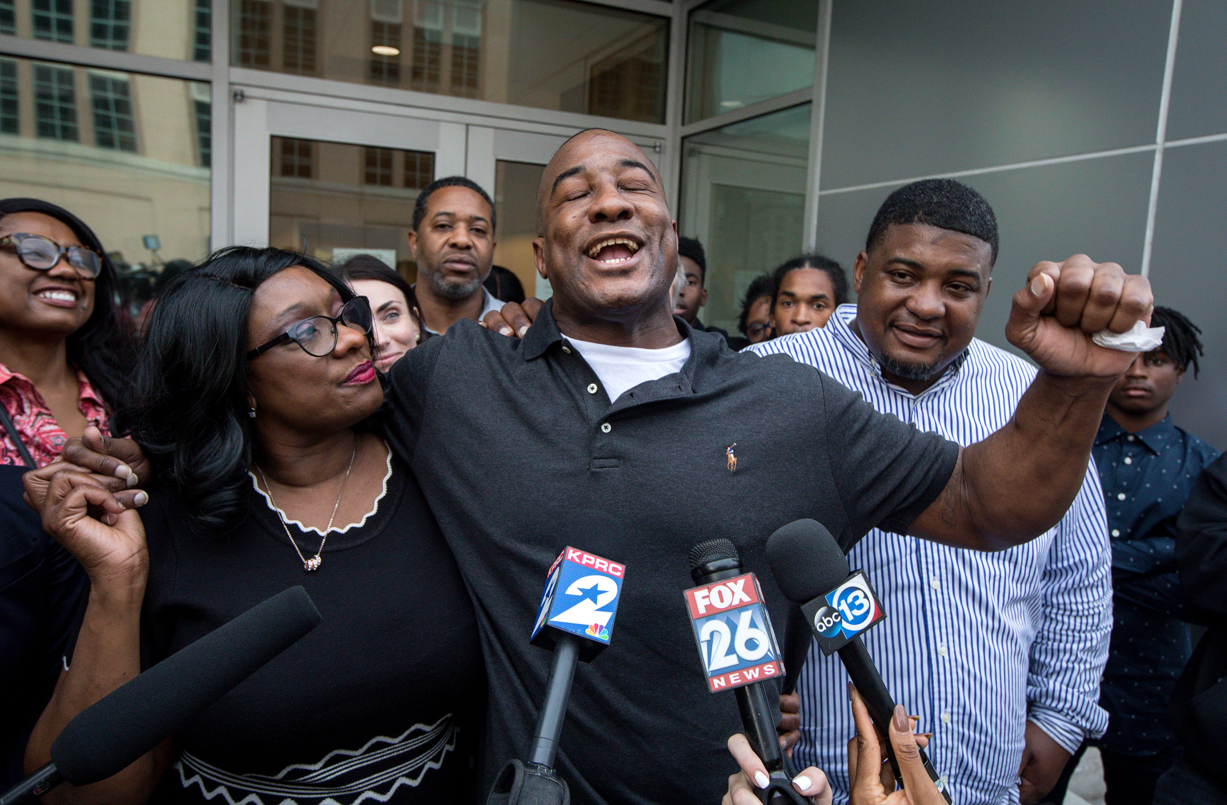 In this Nov. 26, 2019 file photo, Lydell Grant, centre, his mother, Donna Poe, second from left, and brother Alonzo Poe, right, talk to reporters after Grant’s release on bond in Houston