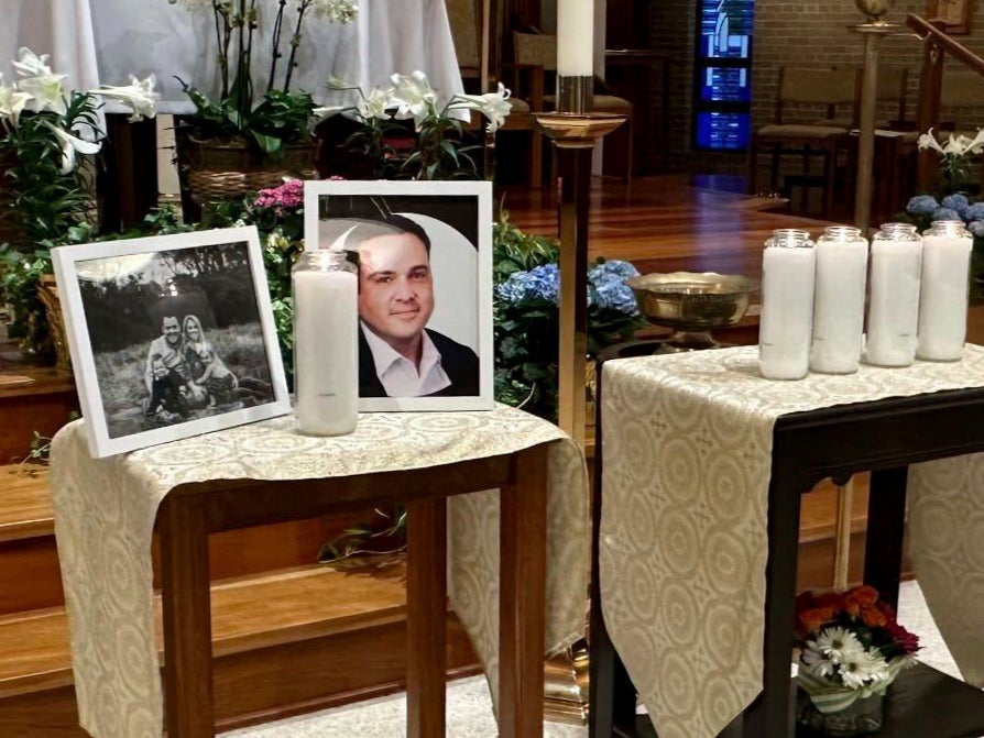 A memorial for Joshua Barrick is on display at Holy Trinity Catholic Church in Louisville