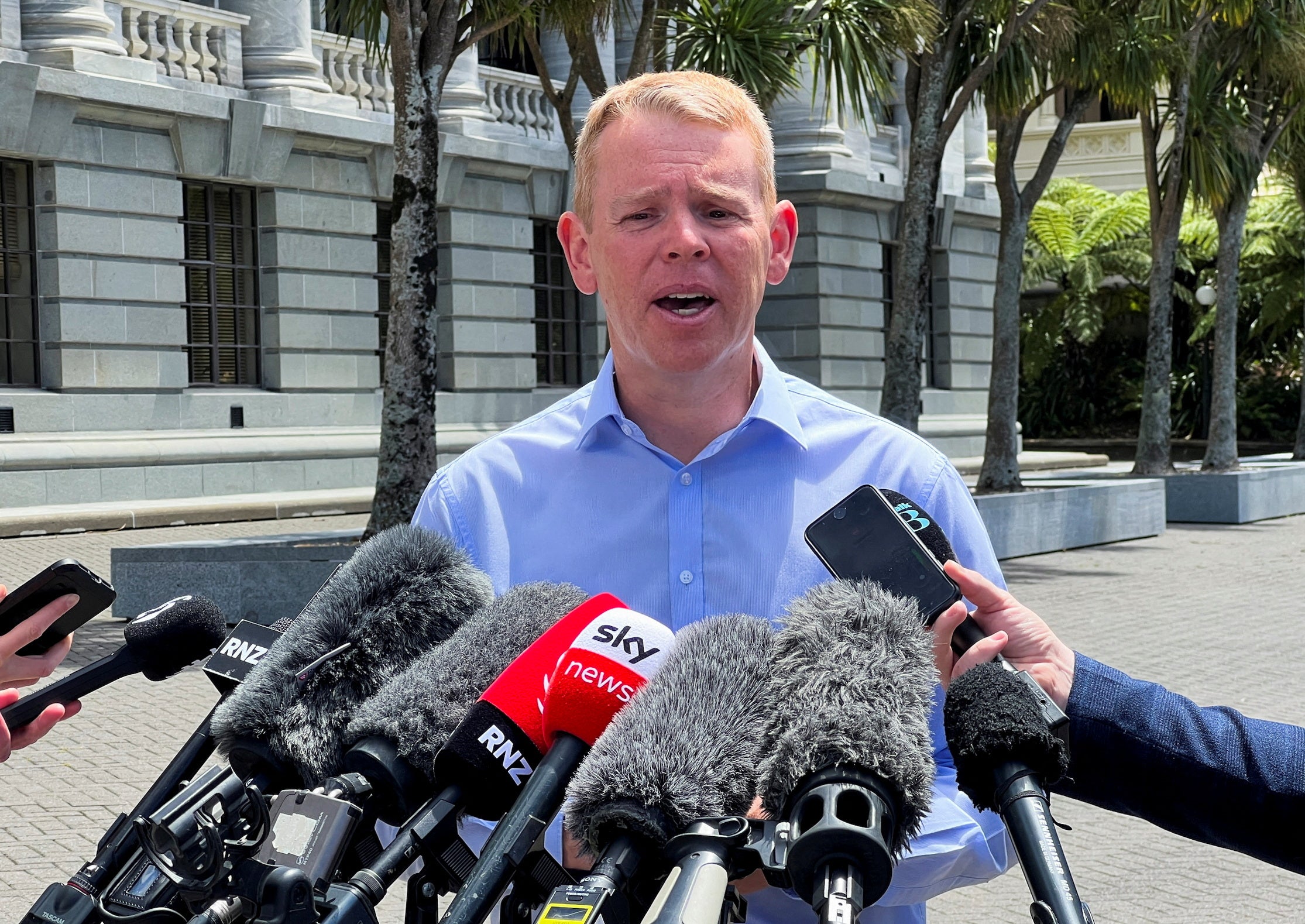 File: New Zealand prime minister Chris Hipkins speaks to media outside parliament