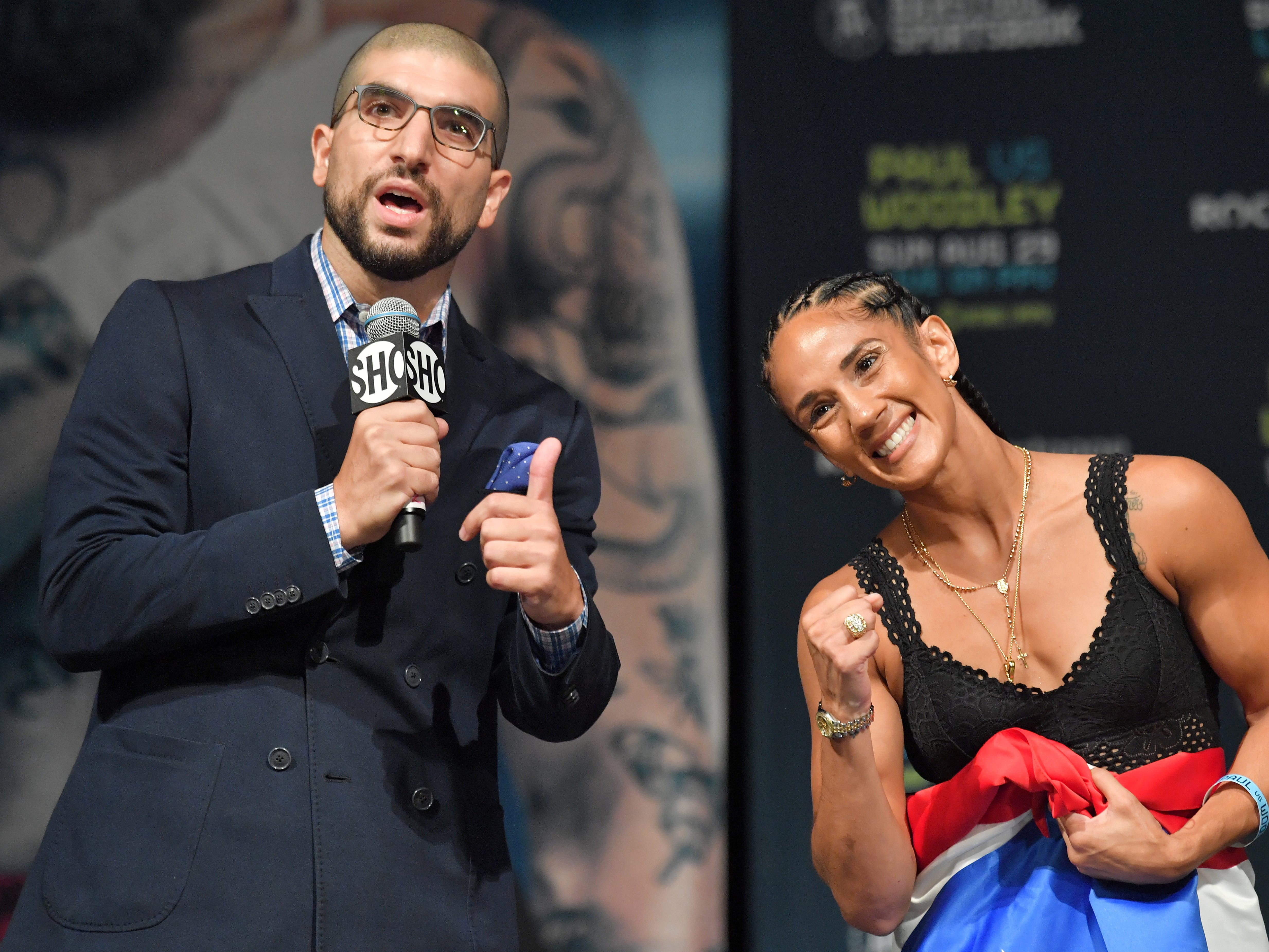 Ariel Helwani, pictured with boxing world champion Amanda Serrano, is a multi-time MMA Journalist of the Year award winner