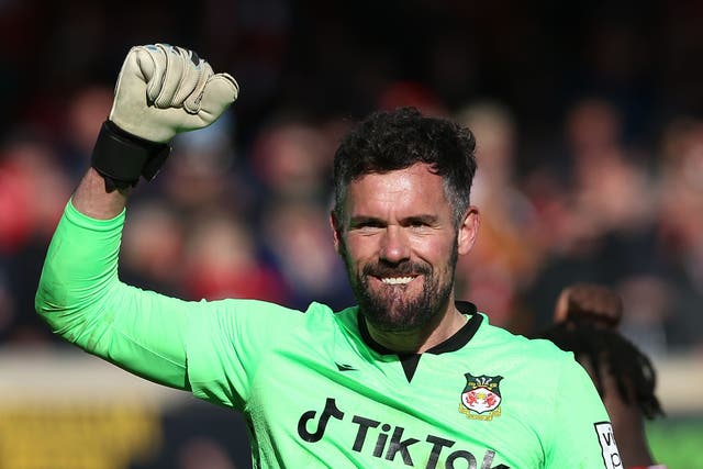 <p>Ben Foster celebrates after Wrexham’s crunch 3-2 Easter Monday victory over Notts County (Barrington Combs/PA)</p>