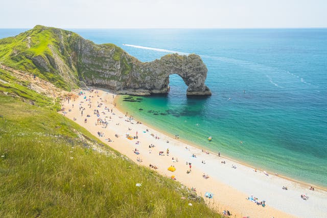 <p>Durdle Door, with its iconic archway, is a great coastal spot for dogs</p>