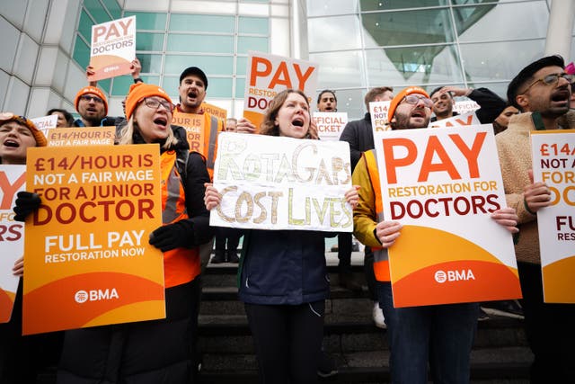 <p>Junior doctors on strike in a bitter dispute over pay have said they are struggling to afford groceries and borrowing money to pay rent (James Manning/PA)</p>