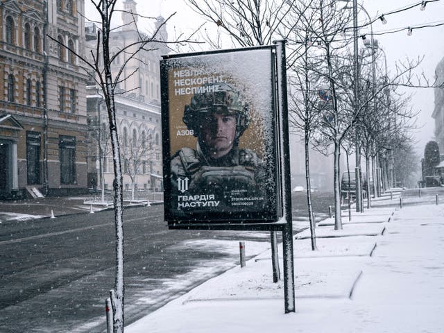 <p>A Ukrainian armed forces mobilisation campaign poster in Kyiv reads: ‘Unbreakable, unconquered, unstoppable’ </p>