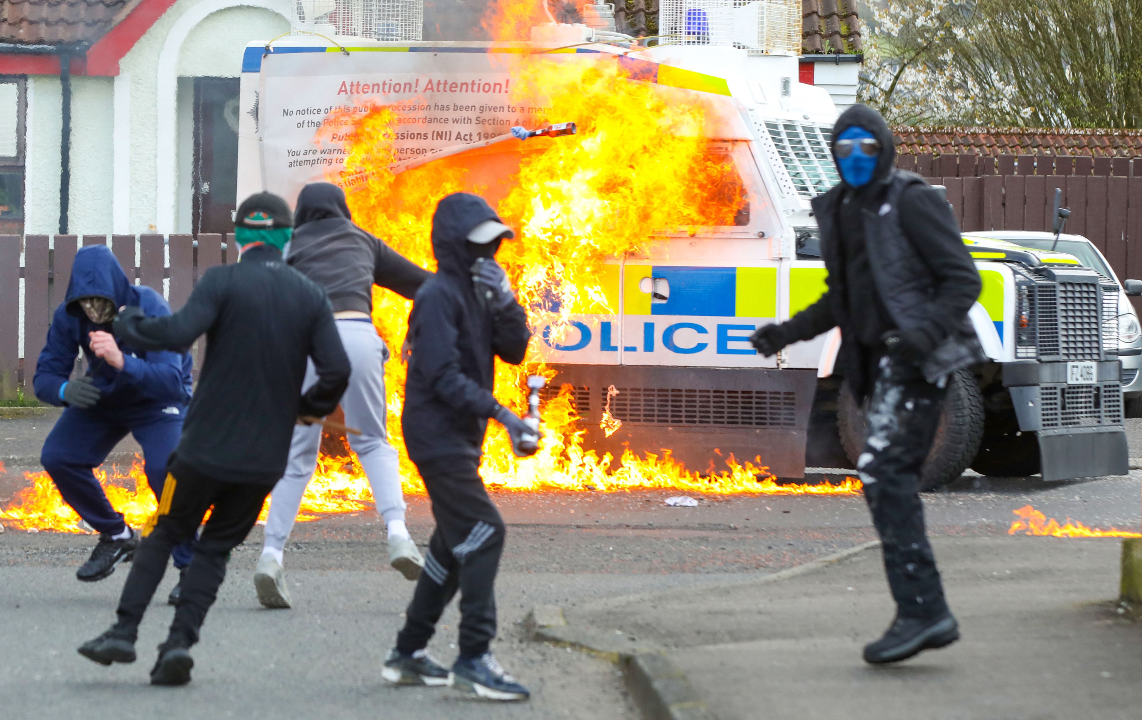 Masked youths attack a police Land Rover with petrol bombs in Creggan on Monday