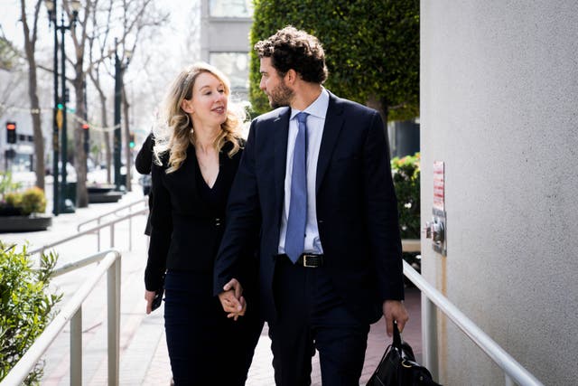 <p>Former Theranos CEO Elizabeth Holmes alongside her boyfriend Billy Evans, leaves a hearing at the Robert E. Peckham US Courthouse on 17 March, 2023 in San Jose, California.</p>
