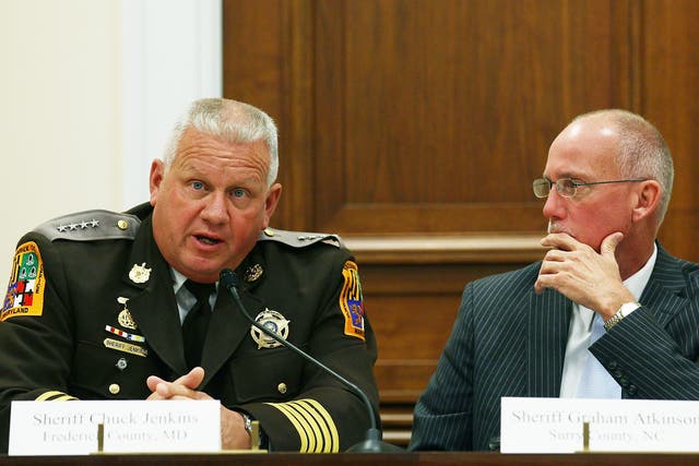 <p>Sheriff Chuck Jenkins left, of Frederick County, Maryland., and Sheriff Graham Atkinson, of Surry County, North Carolina, participate in a discussion on immigration October 12, 2011</p>