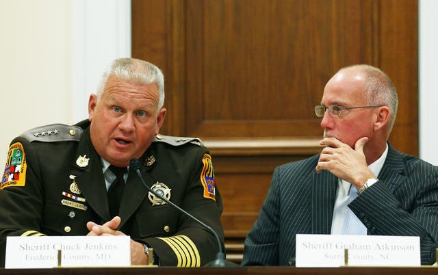 <p>Sheriff Chuck Jenkins left, of Frederick County, Maryland., and Sheriff Graham Atkinson, of Surry County, North Carolina, participate in a discussion on immigration October 12, 2011</p>