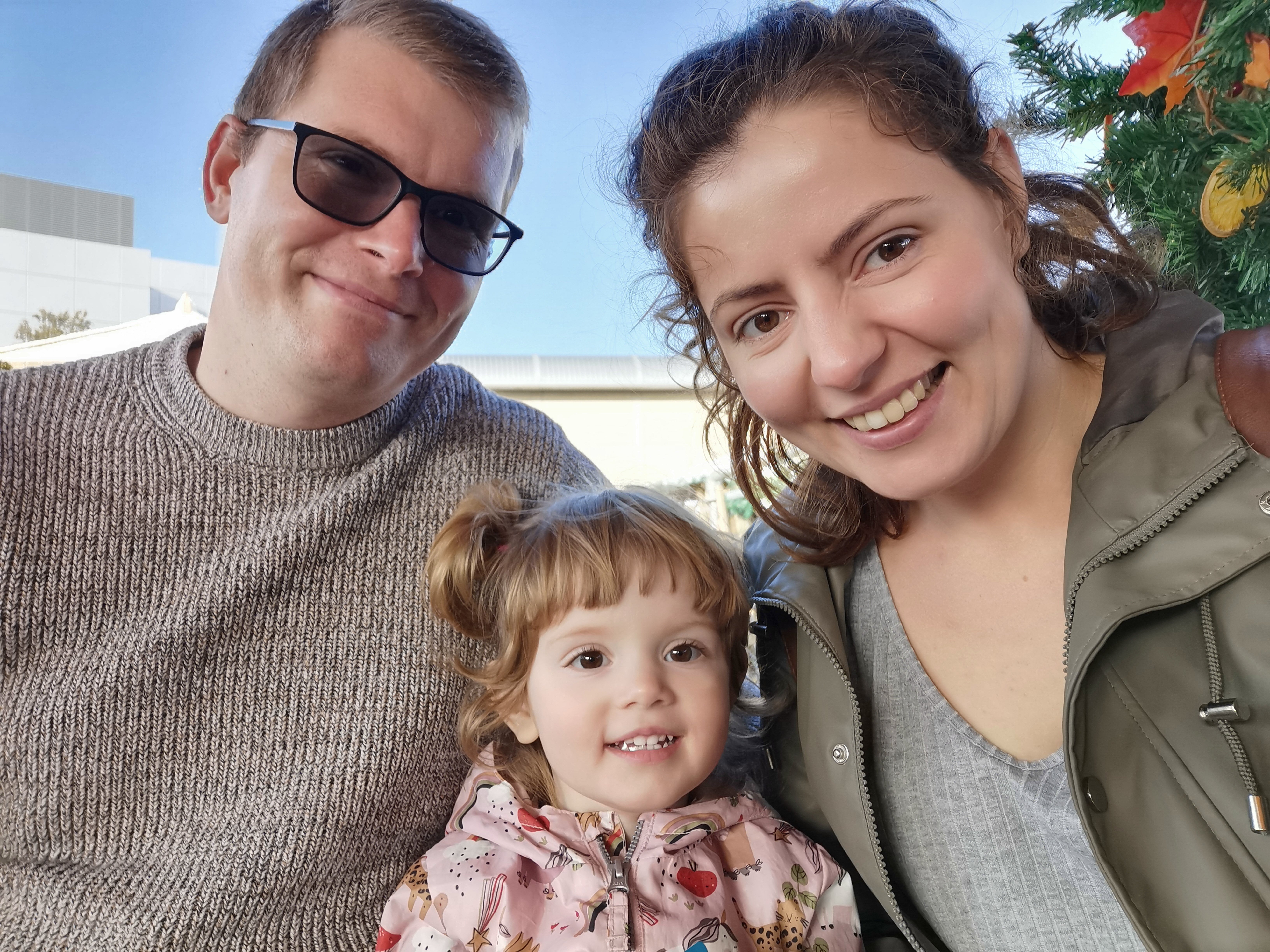 Alicja Banks (right, with her husband) said sending her daughter (centre) to nursery for four days a week would have cost up to £1,120 a month