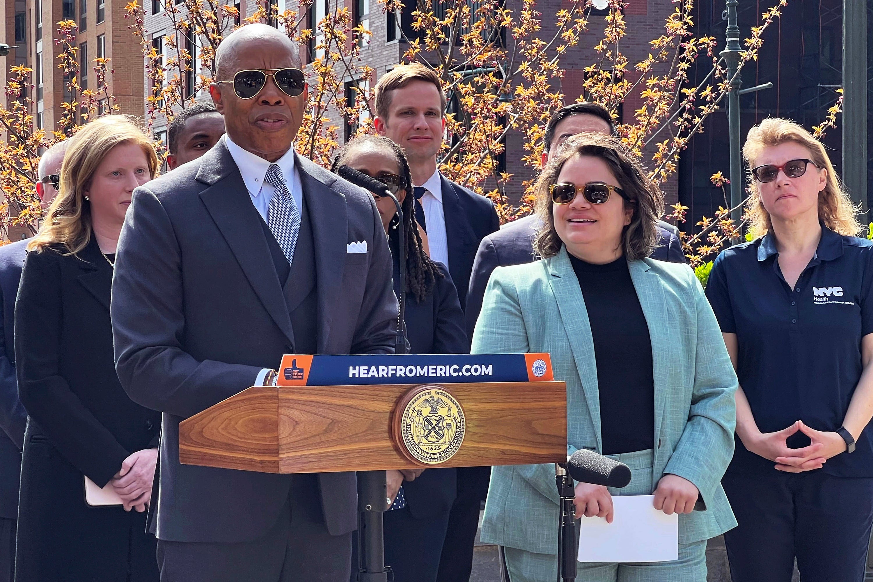 New York Mayor Eric Adams, left, introduces Kathleen Corradi, center, as the city's first-ever citywide director of rodent mitigation, also known as the "rat czar," in New York