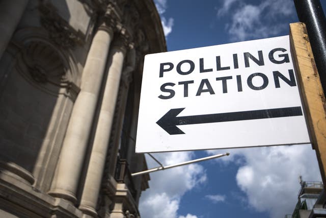 Signage outside a polling station in central Westminster, London. Local elections are taking place across England, as well as parliamentary elections in Scotland and Wales, on Thursday. Picture date: Wednesday May 5, 2021.