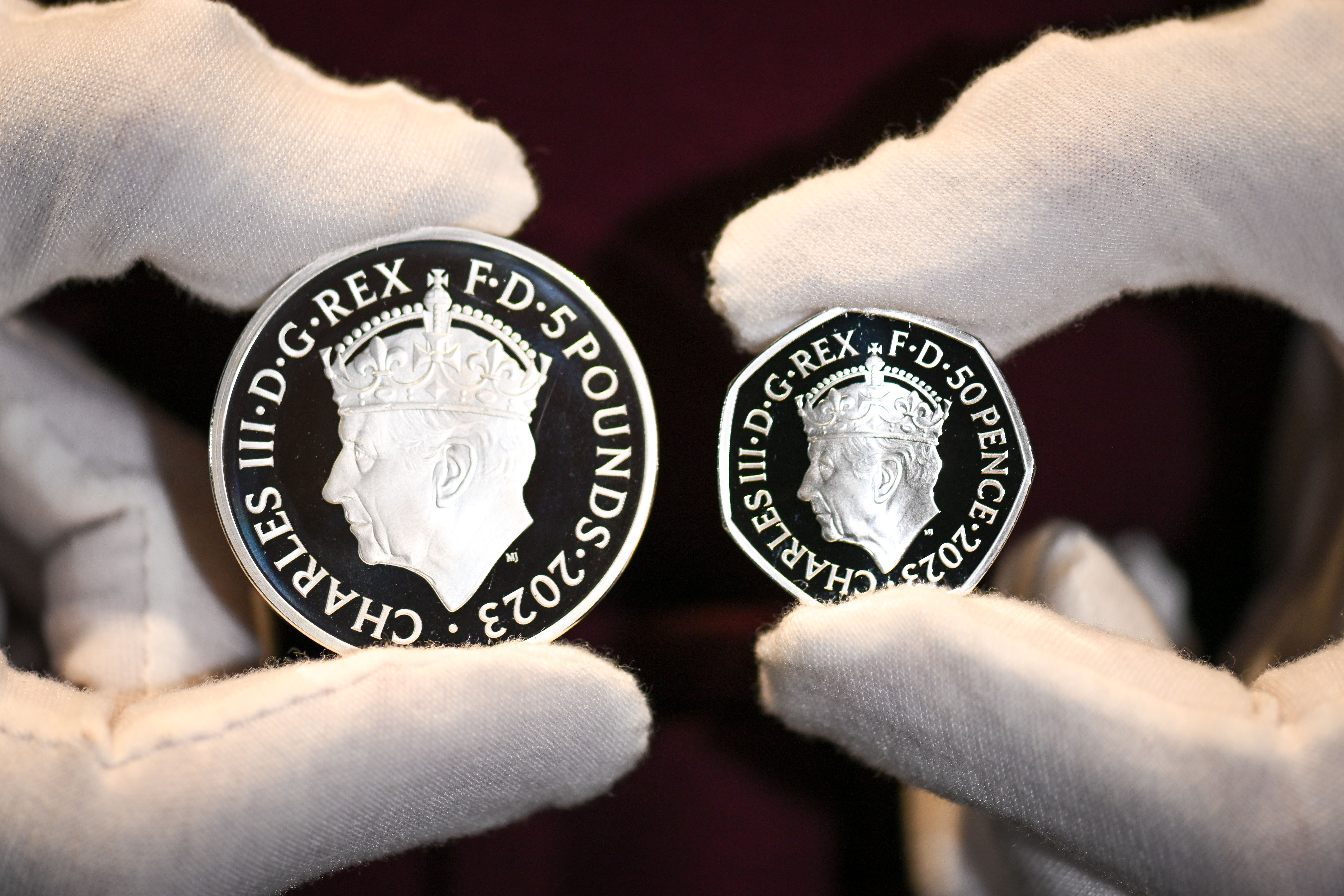 The commemorative Â£5 coin and 50 pence coin is seen at The Royal Mint