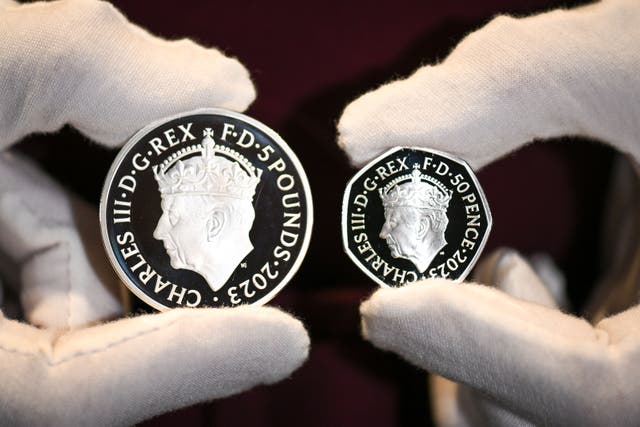<p>The commemorative Â£5 coin and 50 pence coin is seen at The Royal Mint</p>