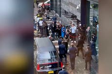 Moment protester running towards Emmanuel Macron tackled to ground