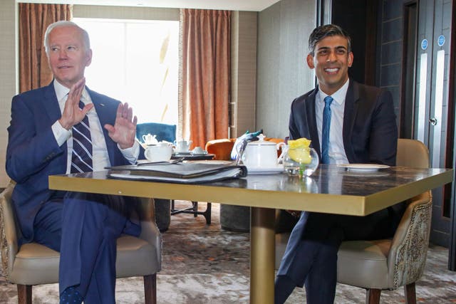Prime Minister Rishi Sunak, right, with US President Joe Biden at the Grand Central Hotel in Belfast (Paul Faith/PA)