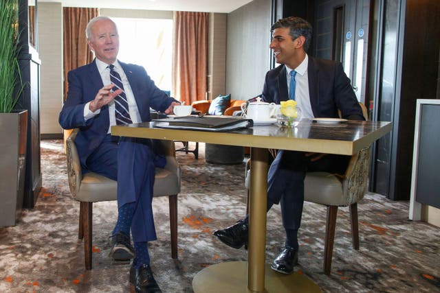 Prime Minister Rishi Sunak with US President Joe Biden at the Grand Central Hotel in Belfast (Paul Faith/PA)