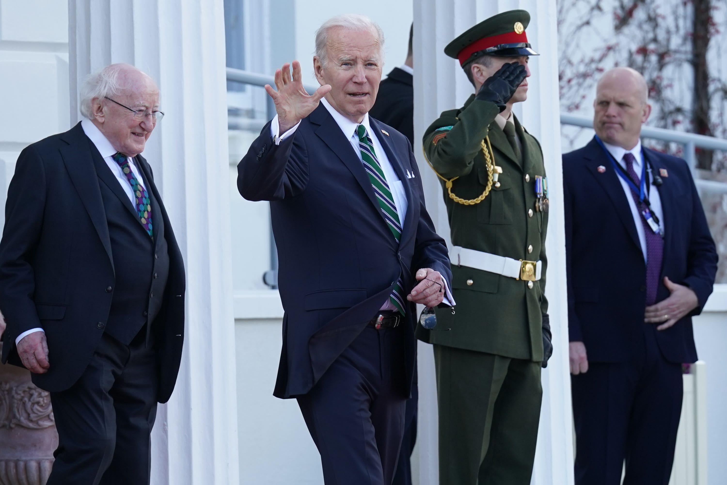 Irish President Michael D Higgins walks behind US President Joe Biden as he departs following a meeting at Aras an Uachtarain (Brian Lawless/PA)