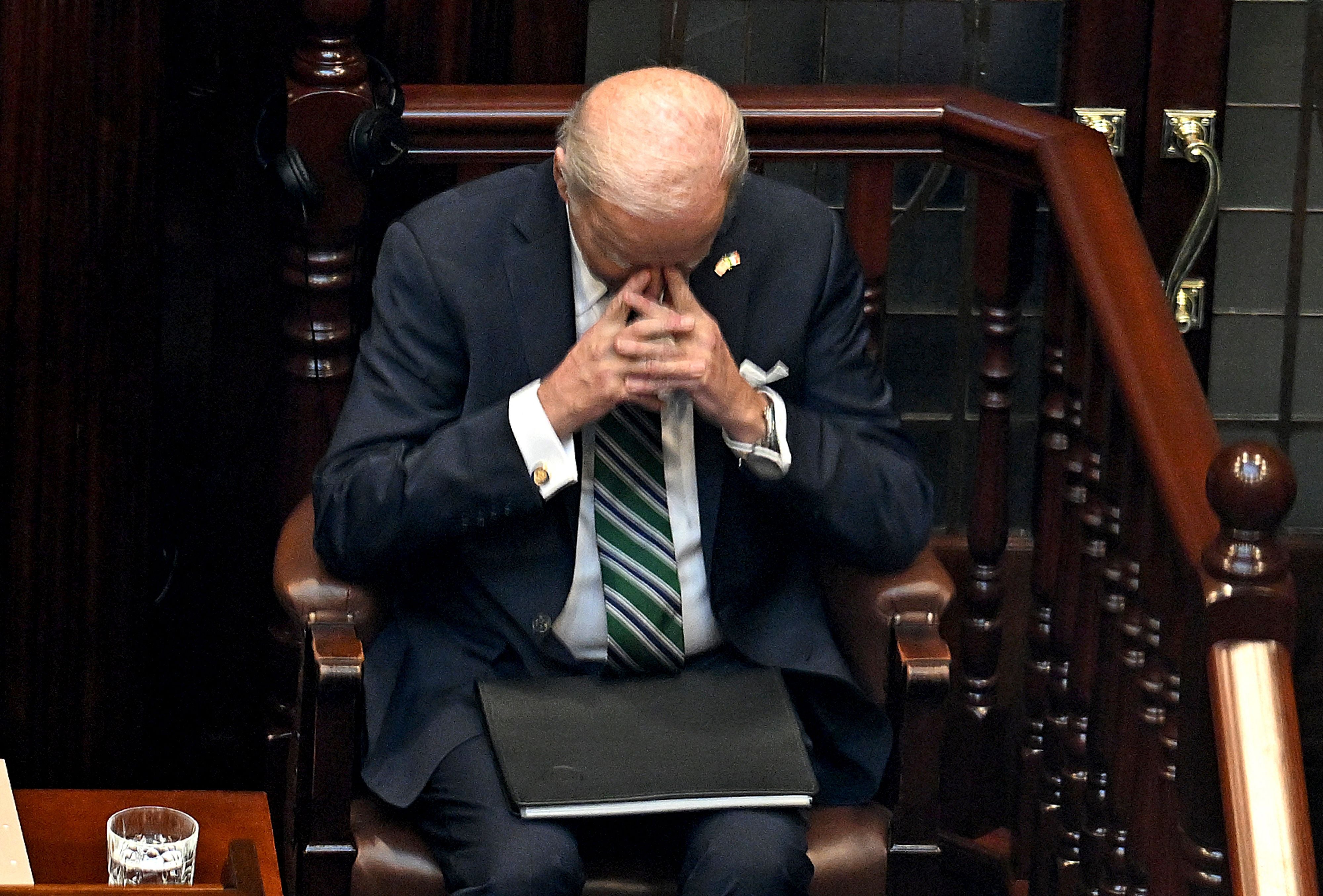 <p>Biden prays after delivering his speech to the Dail</p>