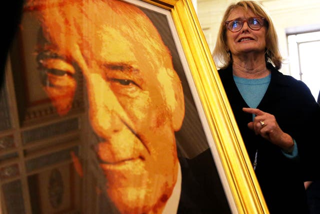 Marie Heaney with a portrait of her husband, poet Seamus Heaney (Brian Lawless/PA)