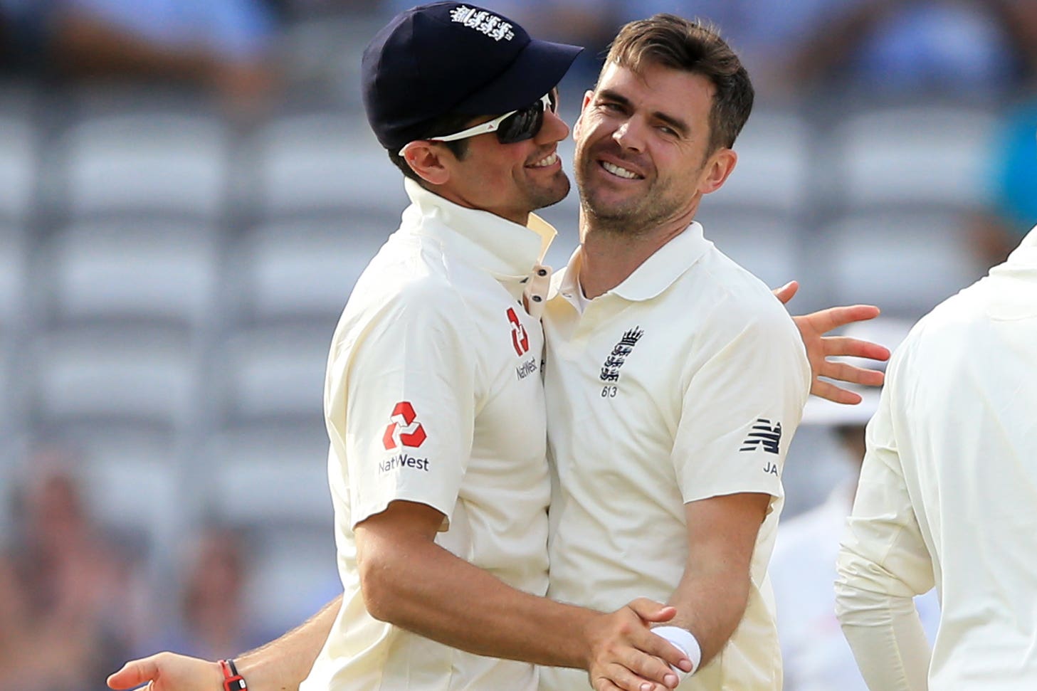 James Anderson, right, got the better of former England team-mate Alastair Cook at Chelmsford (Nigel French/PA)