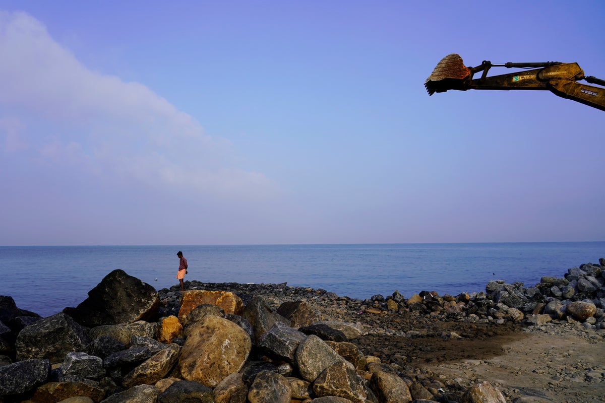 A cyclone-hit Indian hamlet pins its hopes on a sea wall