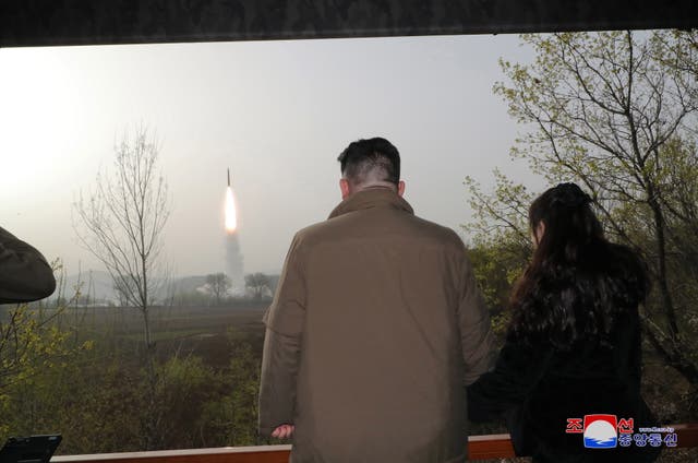 <p>North Korean leader Kim Jong Un (L) and his daughter Kim Ju Ae observing the test firing of a new solid-fuel Hwasong-18 intercontinental ballistic missile (ICBM) at an undisclosed location in North Korea, 13 April 2023 (Issued 14 April 2023). According to KCNA, a new-type of ICBM Hwasongpho-18 </p>