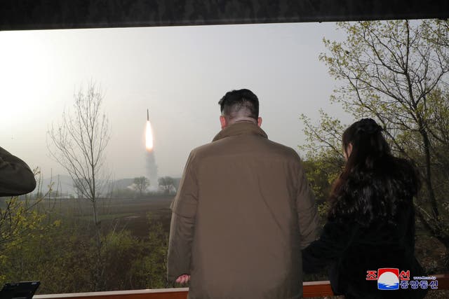 <p>North Korean leader Kim Jong Un (L) and his daughter Kim Ju Ae observing the test firing of a new solid-fuel Hwasong-18 intercontinental ballistic missile (ICBM) at an undisclosed location in North Korea, 13 April 2023 (Issued 14 April 2023). According to KCNA, a new-type of ICBM Hwasongpho-18 </p>
