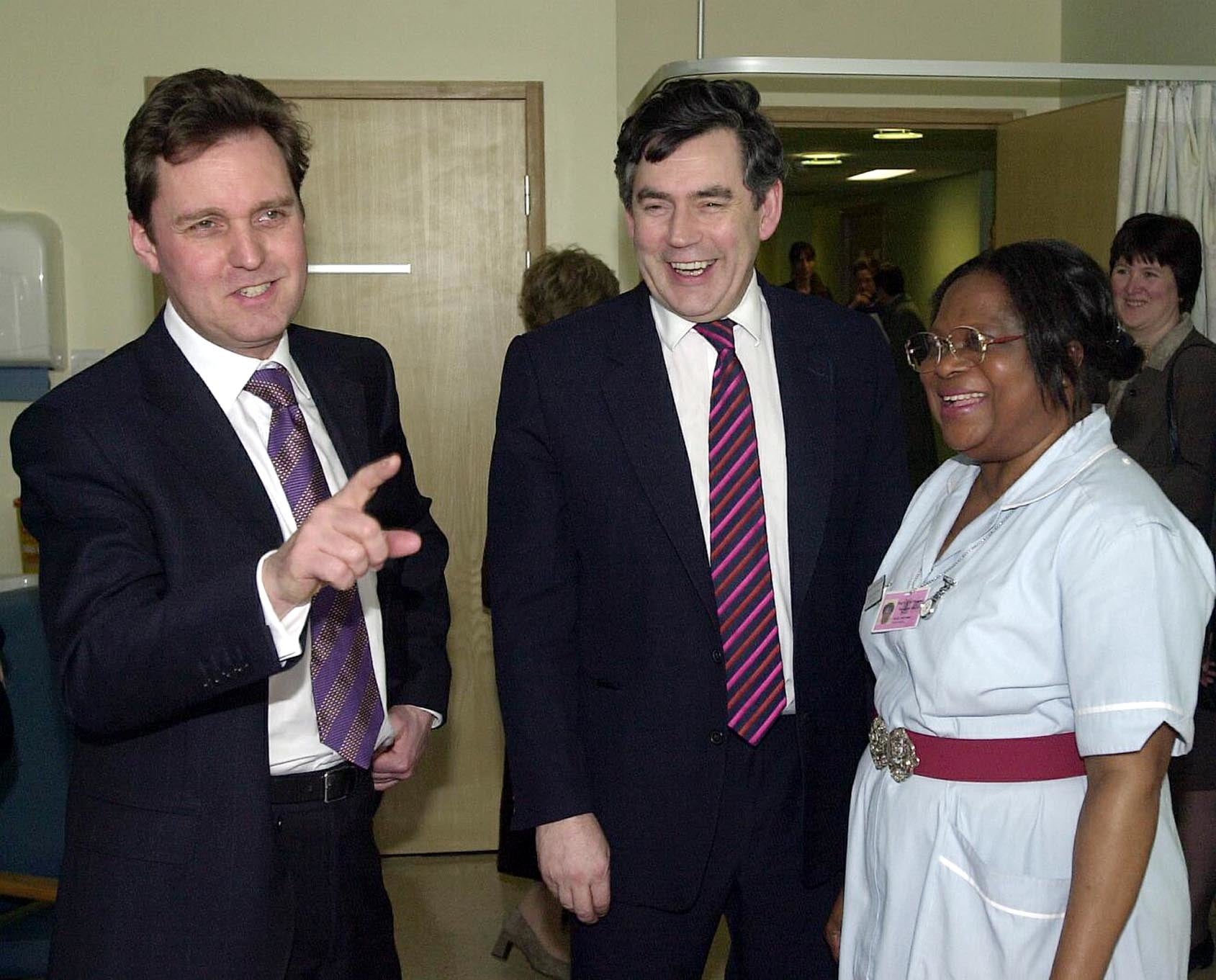 Gordon Brown and Milburn talk to staff nurse Kelme Onyeomah during a visit to the new gynaecology unit at St Thomas’ Hospital in London, 2002