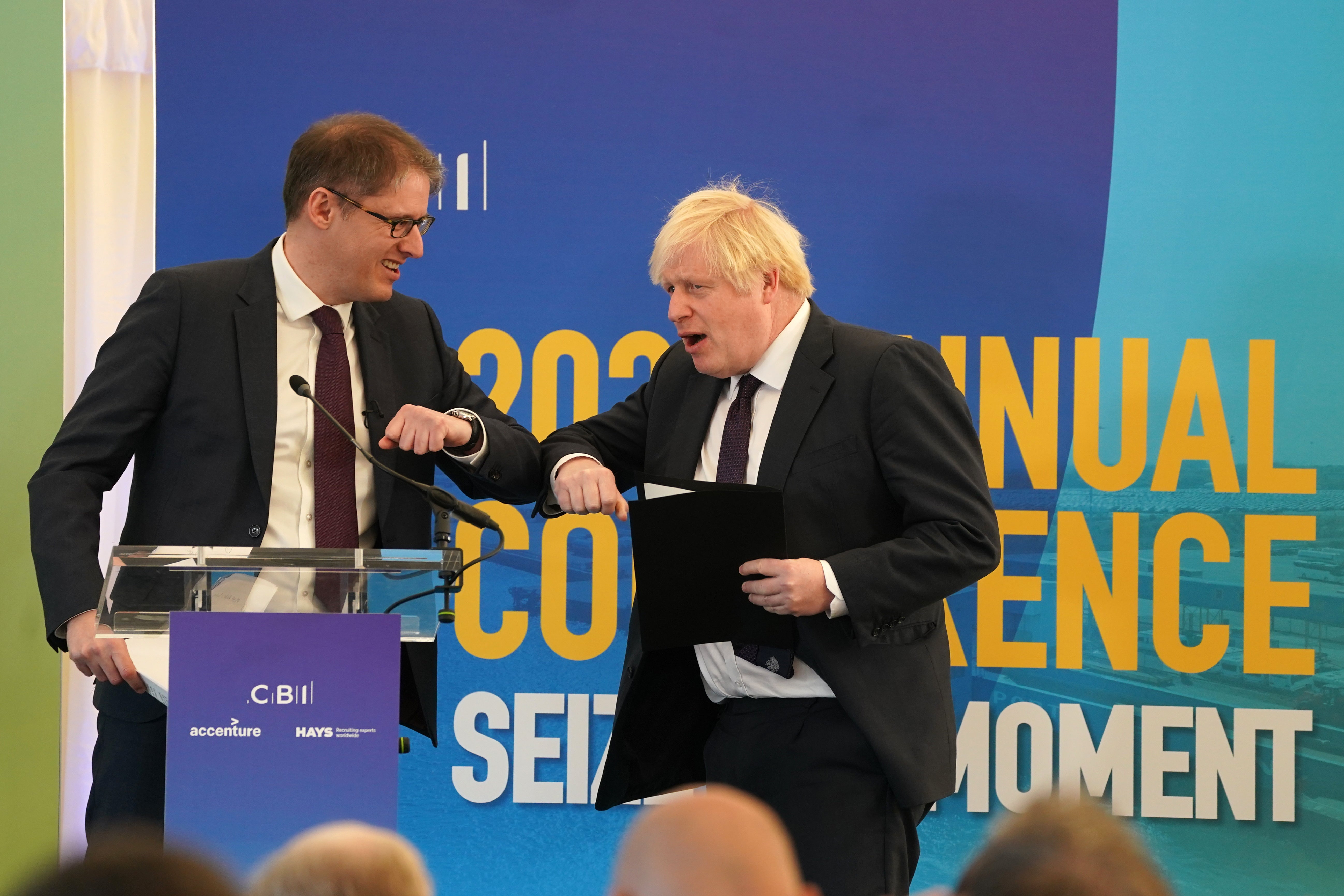 Boris Johnson is greeted by Tony Danker at their annual conference in 2021