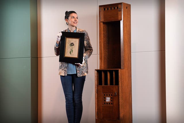 Design specialist Olivia Ross with rare works by Charles Rennie Mackintosh that will form part of the auction (Lyon & Turnbull/PA)
