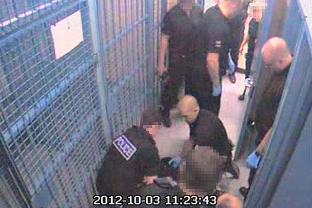 CCTV still showing Thomas Orchard on the floor of the holding cells at Heavitree Road police station (Independent Police Complaints Commission/PA)