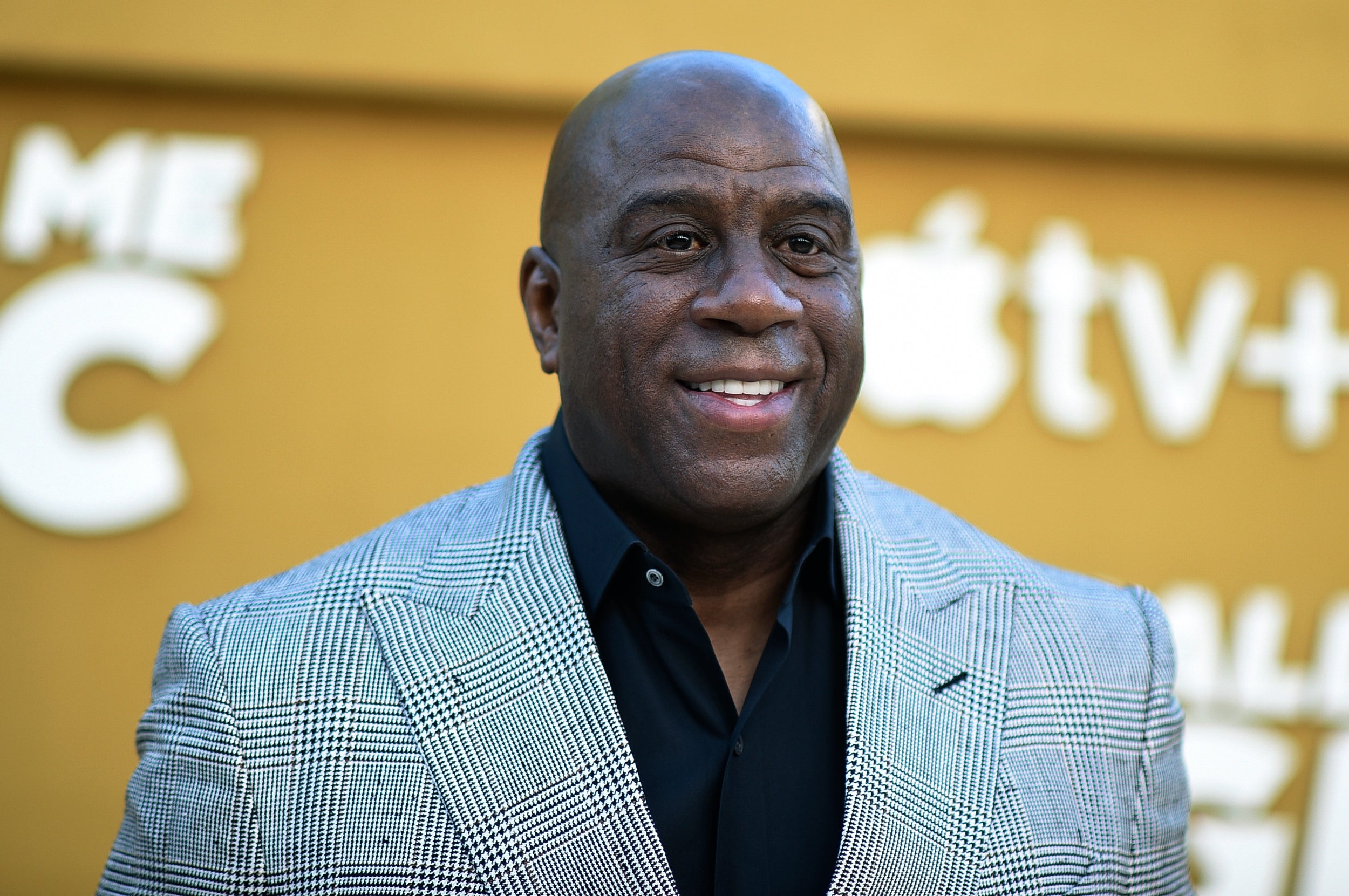 FILE - Magic Johnson arrives at the premiere of "They Call Me Magic" on Thursday, April 14, 2022, at Regency Village Theatre in Los Angeles.