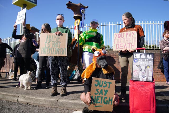 Activists outside Aintree Racecourse (Peter Byrne/PA)
