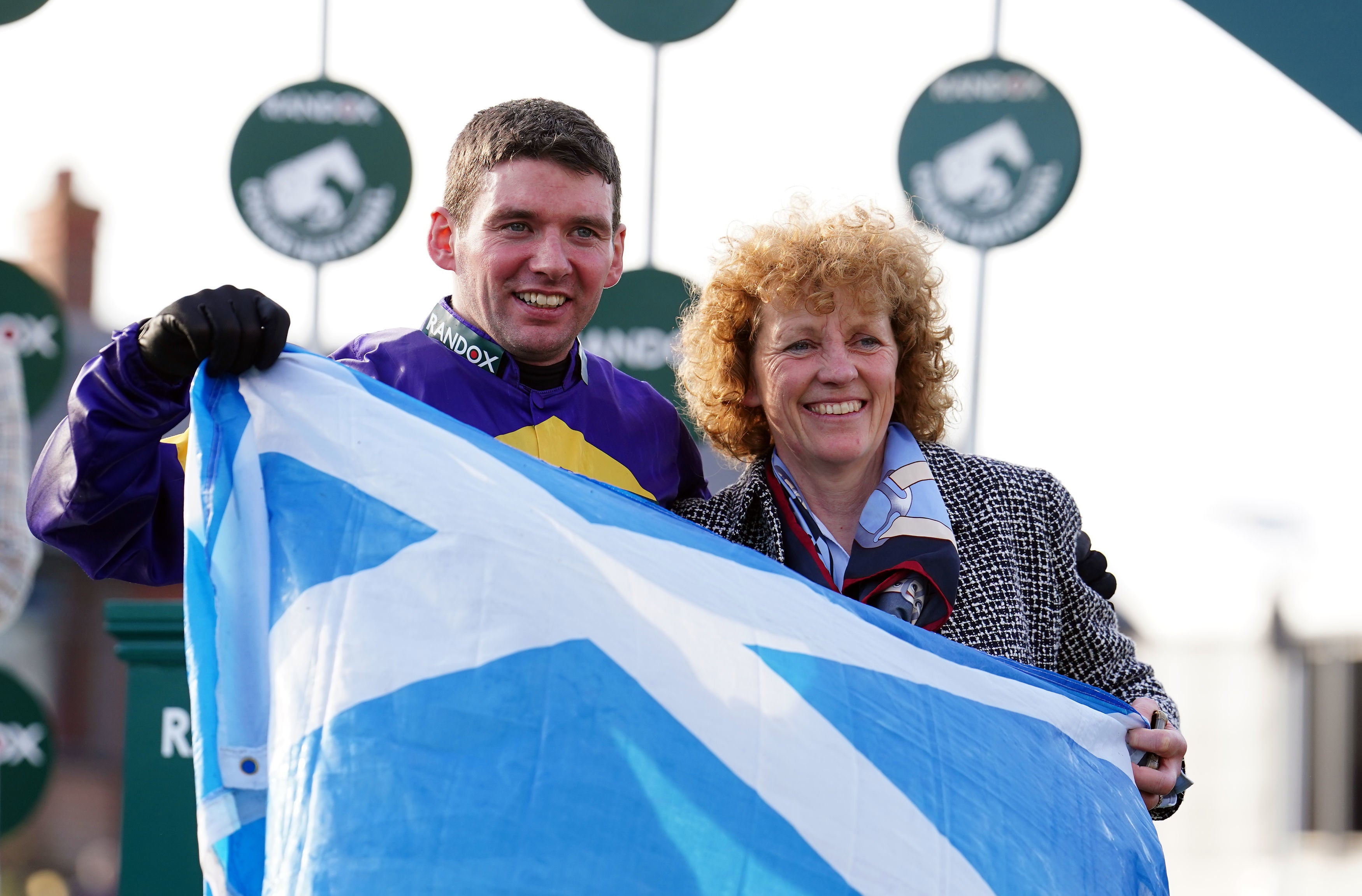 Jockey Derek Fox and trainer Lucinda Russell after winning the Randox Grand National