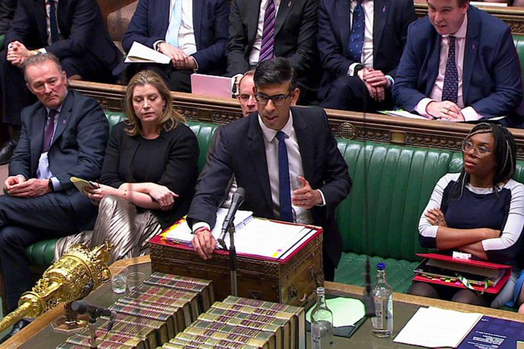 Simon Hart (left) watching Rishi Sunak in the Commons