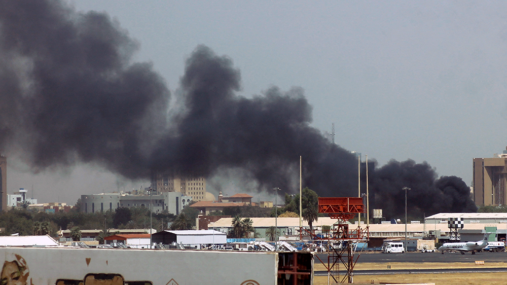 Heavy smoke billows above buildings near the Khartoum airport, which has become a centre of fighting due to its strategic importance