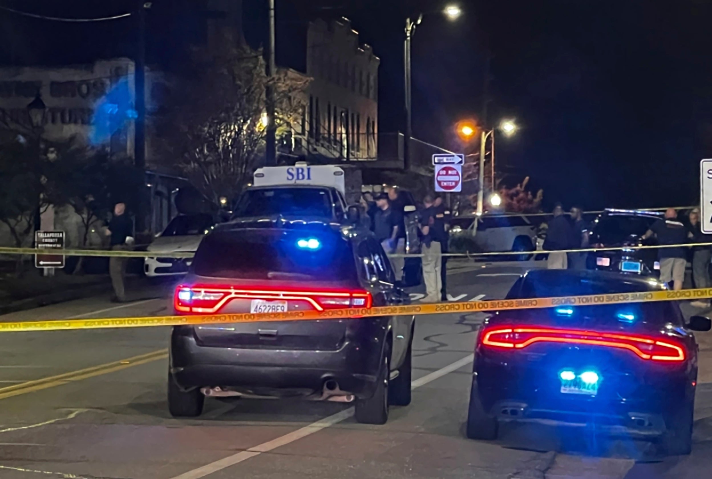 <p>Authorities work on the scene following the shooting (15 April 2023) </p>