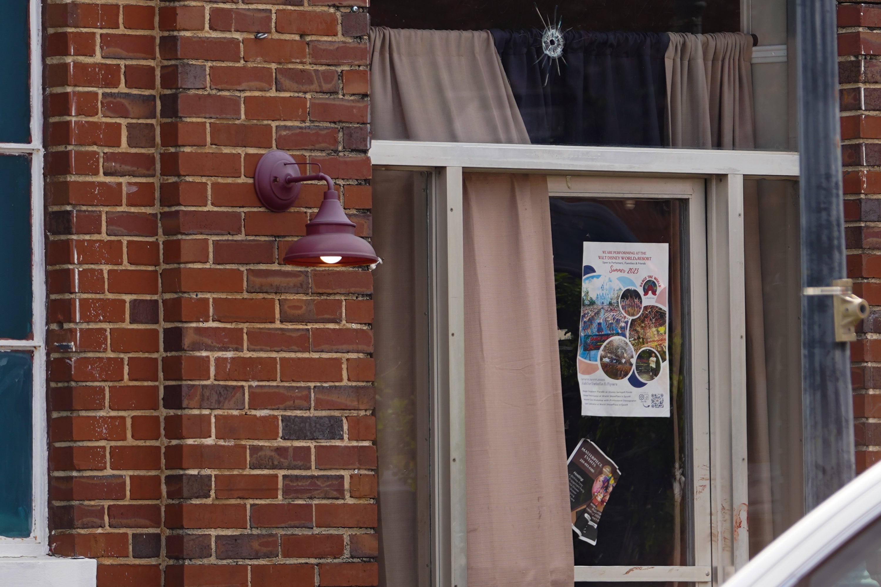 <p>A bullet hole is visible above a door at the Mahogany Masterpiece dance studio after a shooting in Dadeville, Alabama</p>