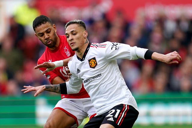 Manchester United’s Antony (right) and Nottingham Forest’s Renan Lodi battle for the ball during the Premier League match at the City Ground, Nottingham. Picture date: Sunday April 16, 2023.