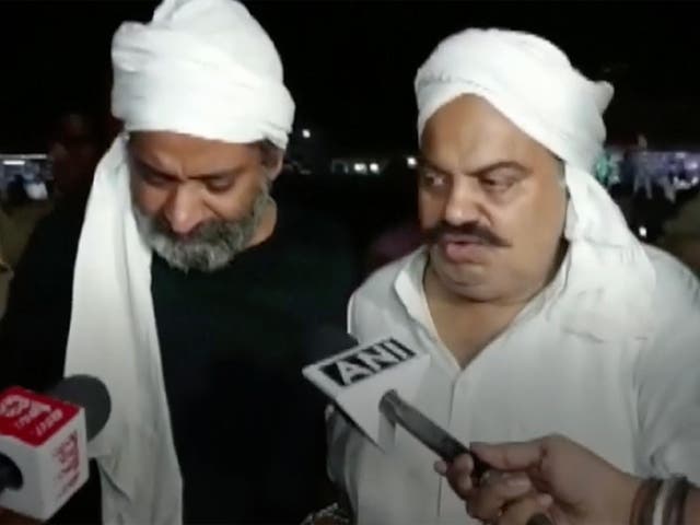 <p>Atiq Ahmed [right] and his brother Ashraf being interviewed by reporters on their way to a medical checkup moments before they were killed</p>