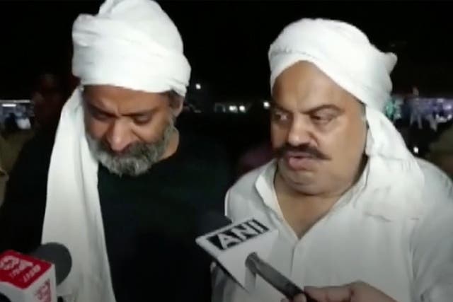 <p>Atiq Ahmed [right] and his brother Ashraf being interviewed by reporters on their way to a medical checkup moments before they were killed</p>