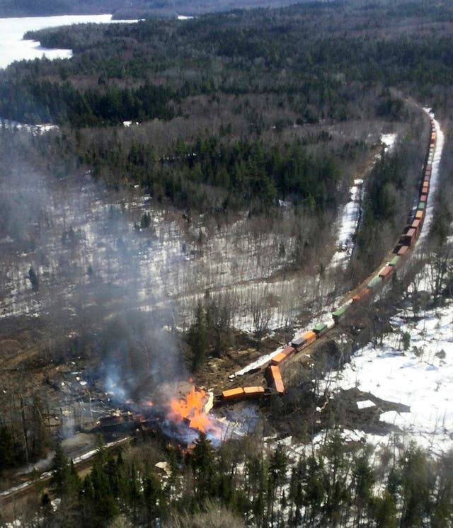 <p>Several locomotives and rail cars burn after a freight train derailed on Saturday in Maine </p>