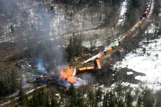 <p>Several locomotives and rail cars burn after a freight train derailed on Saturday in Maine </p>