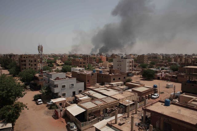 <p>Smoke rises from a central neighborhood of Khartoum, Sudan</p>