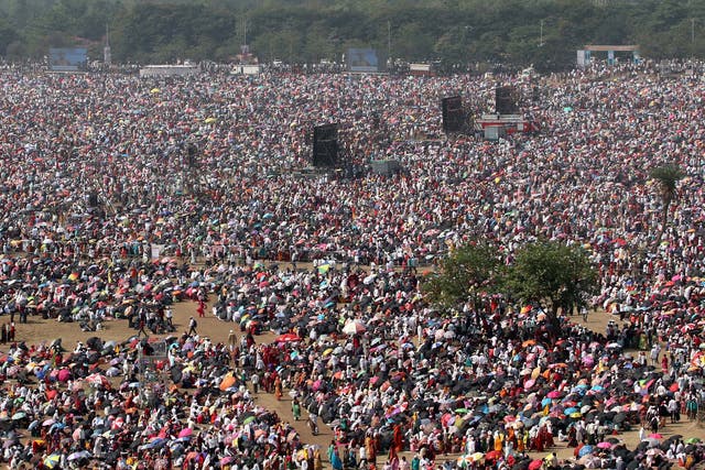 <p>People attend an award function during a hot day on the outskirts of Mumbai on 16 April</p>