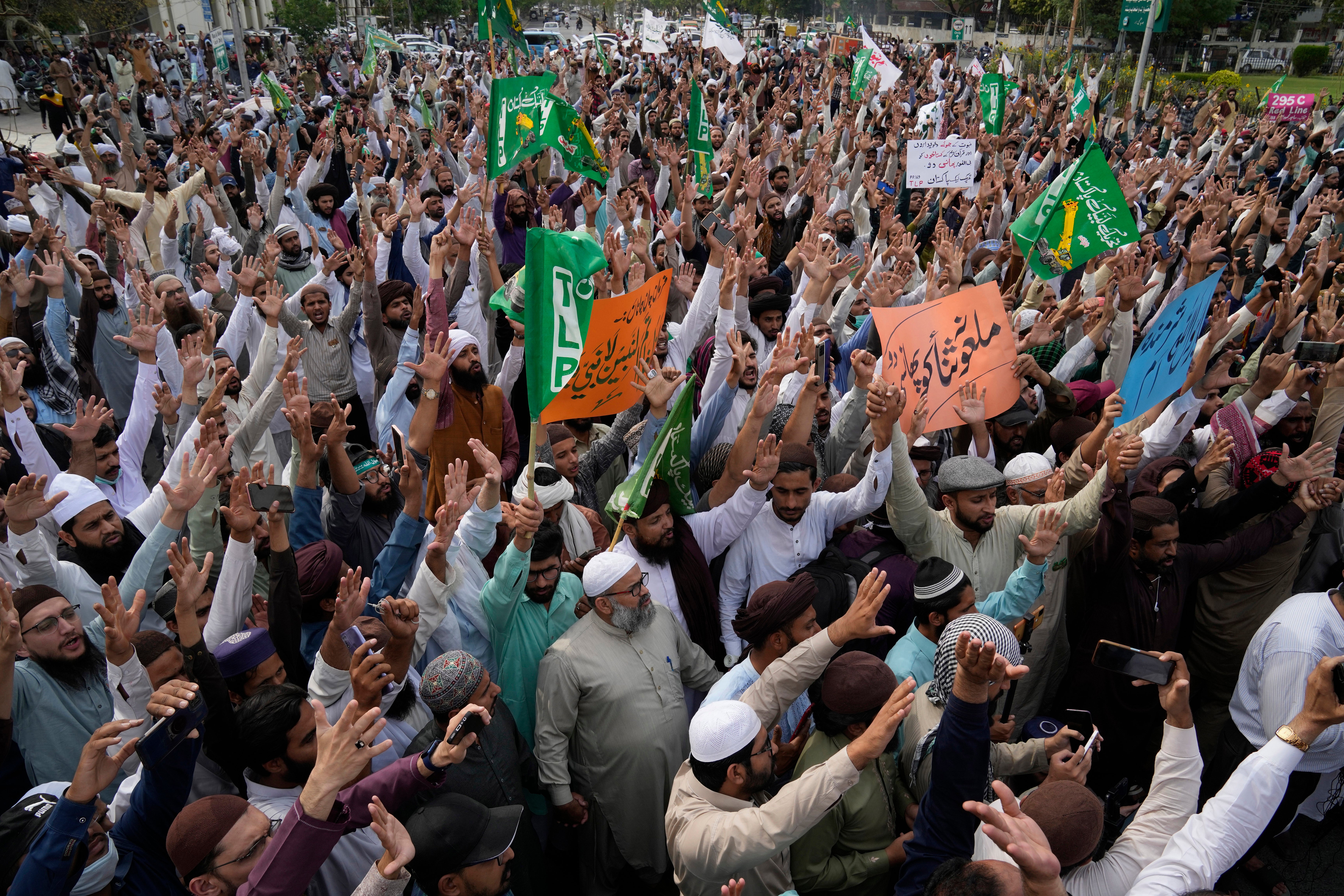 File. Supporters of a religious group ‘Tehreek-e-Labiak Pakistan’ chant slogans during a rally against a woman who was arrested over blasphemy charges, in Lahore, Pakistan, 17 April 2023