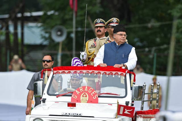 <p>File Jammu and Kashmir state governor Satya Pal Malik (R) reviews a guard of a honour during a ceremony to celebrate India’s 73rd Independence Day</p>